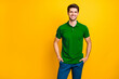 © deagreez - Photo of confident cheerful reliable business person holding his hands in pockets smiling toothily beaming looking successful isolated over yellow vivid color background
