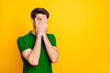 © deagreez - Portrait of his he nice attractive scared guy wearing violet shirt hiding face in palms peeking isolated on bright vivid shine vibrant yellow color background