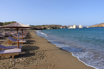 Wall Mural - Paradise sandy organised beach of Mavrospilia with white rock formations best place to see the sunset in the island of Kimolos, Cyclades, Greece