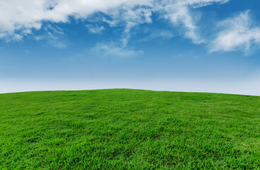 Wall Mural - landscape green grassland on blue sky and clouds panoramic background, outdoor atmosphere, refreshin