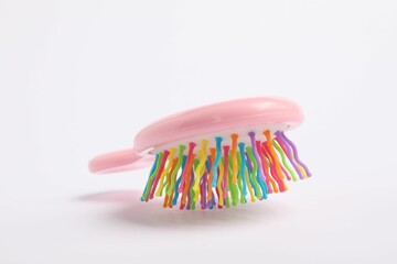 Wall Mural - One colorful hair brush on white background