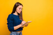 © deagreez - Profile side view portrait of her she nice-looking attractive winsome focused intelligent straight-haired girl writing to-do check list isolated over bright vivid shine yellow background