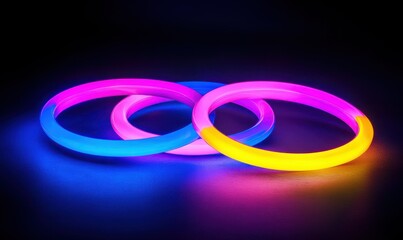 Sticker - Glowing neon rings in vibrant pink, blue, and yellow hues against a dark background, creating a futuristic and dynamic composition