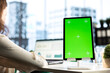 © DC Studio - Female chief executive officer working with mockup copy space screen on device, developing a project for enterprise growth and objectives achievement. Female director with determination.
