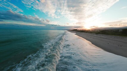 Wall Mural - Sea Waves Crash on the Beach after a Relaxing Sunset in Nature Aerial