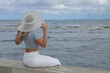 © zhagunov_a - Stylish woman in summer outfit posing by the sea.
