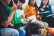© Phushutter - Five young Asian students engage in online study on campus, collaborating on research, projects. They help each other with assignments, gaining valuable experience and preparing for future careers.