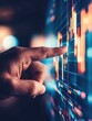 © Luminostock 54 - investor opportunity stocks successful concept. A hand pointing at a digital financial chart displaying fluctuating data and trends.