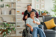 © Yingyaipumi - portrait of Happy elderly couple with lifestyle after retirement concept. Lovely asian seniors couple embracing together in living room at home in the morning.