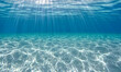 © Swaha - Sunbeams penetrate crystal-clear ocean water, illuminating the sandy seabed. A serene underwater scene perfect for backgrounds or design projects.