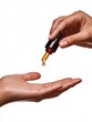 © Coffee Cafe Lover - Person Holding Dropper with Essential Oil Over Open Hand