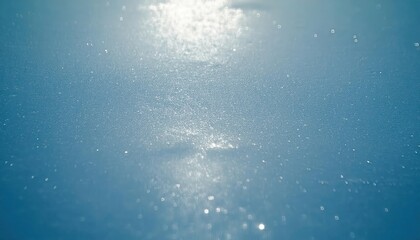 Poster - soft sunlight reflection on the textured frozen lake surface with shimmering ice crystals, creating a serene winter abstract scene

