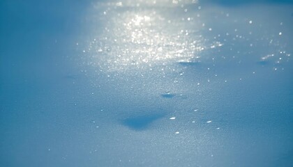 Poster - soft sunlight reflection on the textured frozen lake surface with shimmering ice crystals, creating a serene winter abstract scene

