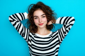 Wall Mural - Young Woman in Striped Sweater Studio Portrait