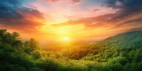 Wall Mural - Sunset over lush green hills with vibrant orange and purple skies, casting warm light across the valley, creating a serene and tranquil atmosphere.