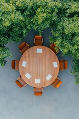 Aufkleber - Eco-Inspired Corporate Meeting Wooden Round Table with Chairs and Devices Amidst Greenery - Strategic Teamwork and Sustainable Business Planning in Modern Office Context