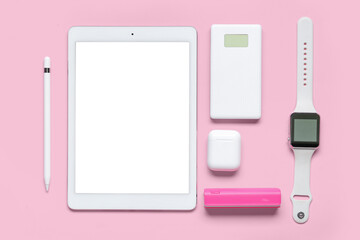 Wall Mural - composition with modern gadgets on pink background