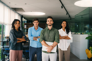 Wall Mural - group of busy happy diverse professional business team people working in office using digital tablet