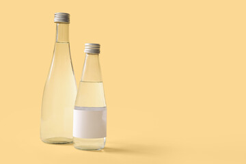 Wall Mural - Bottles of clean water on beige background