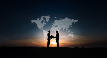 Aufkleber - Silhouetted figures shake hands against a backdrop of a world map at dusk, symbolizing global business and international collaboration under a vibrant sky.
