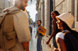 © bernardbodo - Tourists walking down the street in lisbon, portugal, exploring the city