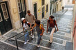 © bernardbodo - Tourists walking down stairs in lisbon, portugal, exploring the city