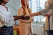 © bernardbodo - Businesswomen handshaking with new colleague