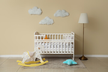 Wall Mural - Interior of children's room with baby crib, rocking horse and lamp