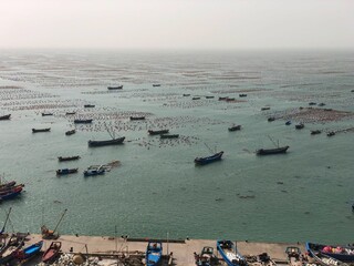 Wall Mural - Aerial view of calm sea with boats