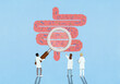 © fStop - Scientists with magnifying glass examining bacteria in intestines