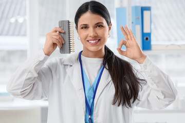 Poster - Female dentist with teeth color samples showing OK in clinic