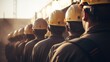 © photolas - A lot of construction workers on a building site. View from behind many working miners in protective helmets and soiled overalls.