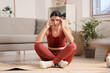 © Pixel-Shot - Sporty young woman suffering from headache at home