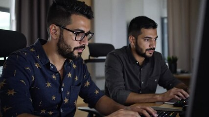 Hispanic Latin American couple, software engineer developer use computer, work on program coding together at home office. Programming language development technology, freelance job concept