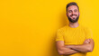 © Maksym - A cheerful bearded man stands confidently against a vibrant background, wearing a casual t-shirt with arms crossed. His joyful smile radiates positivity and self-confidence.