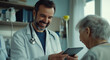 © Саша Федюк - Doctor shares an engaging moment with an elderly patient while reviewing medical details on a tablet in a healthcare setting