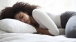 © Jorda - Stomach pain relief while resting on a bed, with a pillow supporting the abdomen. Featuring discomfort and rest