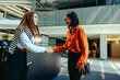 © Jacob Lund - Professional business colleagues greeting each other with a handshake ahead of a corporate meeting