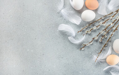 Wall Mural - easter willow branch and eggs on a blue background. happy easter holiday concept. place for text, to