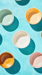 Aufkleber - Colorful Ceramic Bowls on a Bright Turquoise Background with Shadows