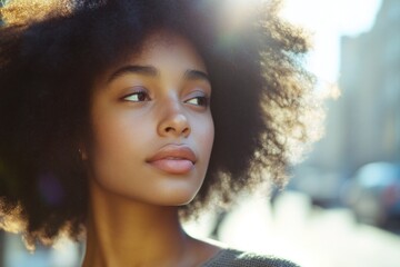 Wall Mural - African American woman with natural hair looking directly at the camera