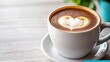 © KIMEHIME - Latte art coffee cup on light wood table. Possible use Stock photo for cafes, restaurants, or food blogs