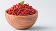 © kwanchanachai - Fresh Goji Berries in a Wooden Bowl on Light Background