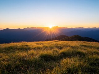 Wall Mural - sunrise over mountains with grassy foreground