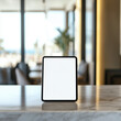 © Vitalii - A small tablet with white mock up screen on a reception desk in a luxury beach resort hotel