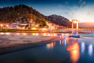 Wall Mural - illuminated evening cityscape of berat town. colorfulk spring sunset in albania. amazin outdoor scen
