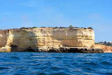 Wall Mural - The Algarve Rocks Formation is a unique and stunning natural wonder located in the coastal town of Porches Portugal