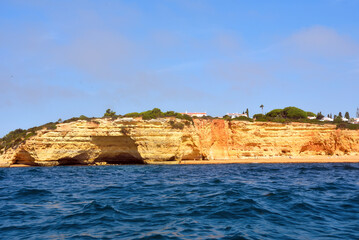 Wall Mural - The Algarve Rocks Formation is a unique and stunning natural wonder located in the coastal town of Porches Portugal