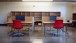 © lestari - Empty modern office workspace with red chairs