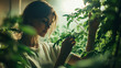 © Korkiat - Smiling girl enjoying nature in a garden, park, and forest surrounded by trees, flowers, and greenery in the spring or summer season